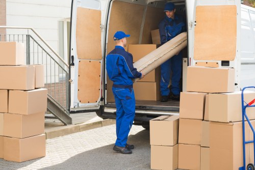 House movers loading furniture in East Ham street