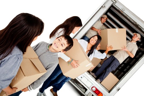 Household boxes and furniture ready for transport in East Ham