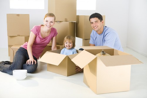 Local moving team handling furniture in an East Ham flat