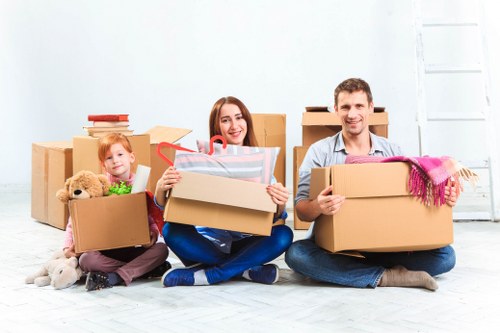 Packed office boxes and furniture ready for relocation in East Ham
