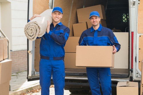 Man with a van loading furniture for a house move