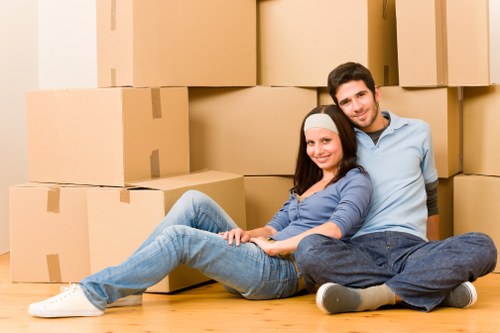 Packed moving boxes and furniture in an East Ham property