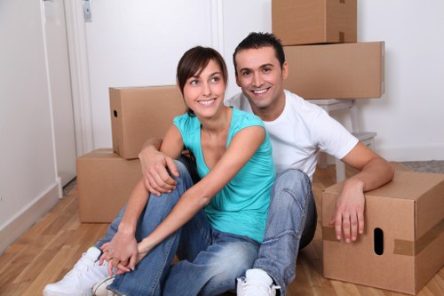 Van moving team handling items safely with protective equipment