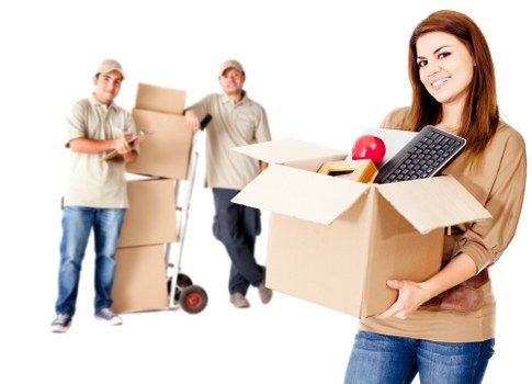 Movers loading boxes into a van for an East Ham home move